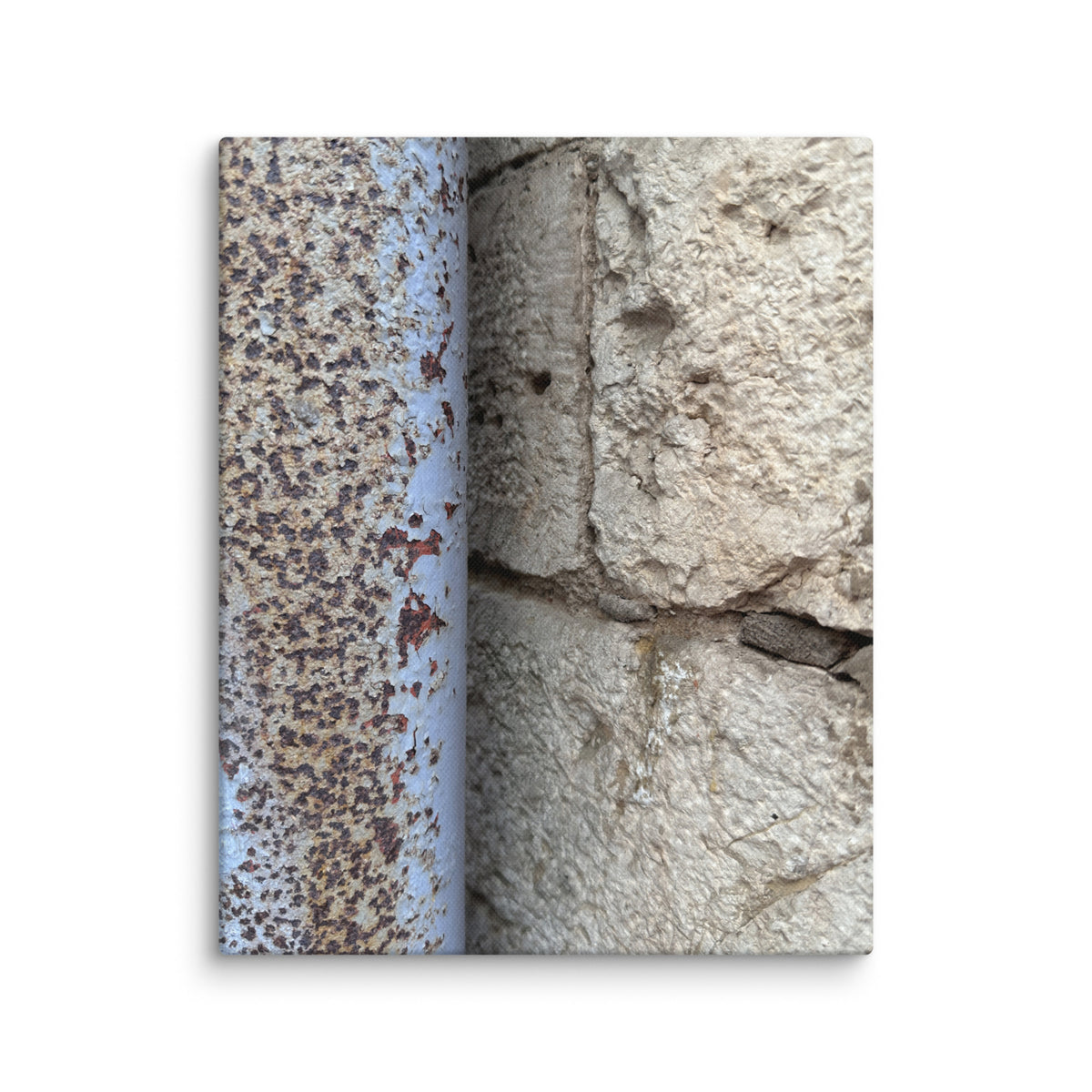 Crumbling cream plaster wall with rusted pipe in Vieux Nice, France — canvas print