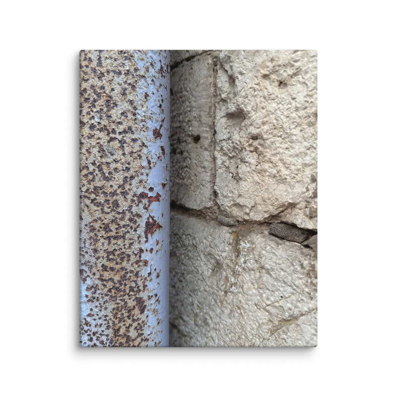 Crumbling cream plaster wall with rusted pipe in Vieux Nice, France — canvas print